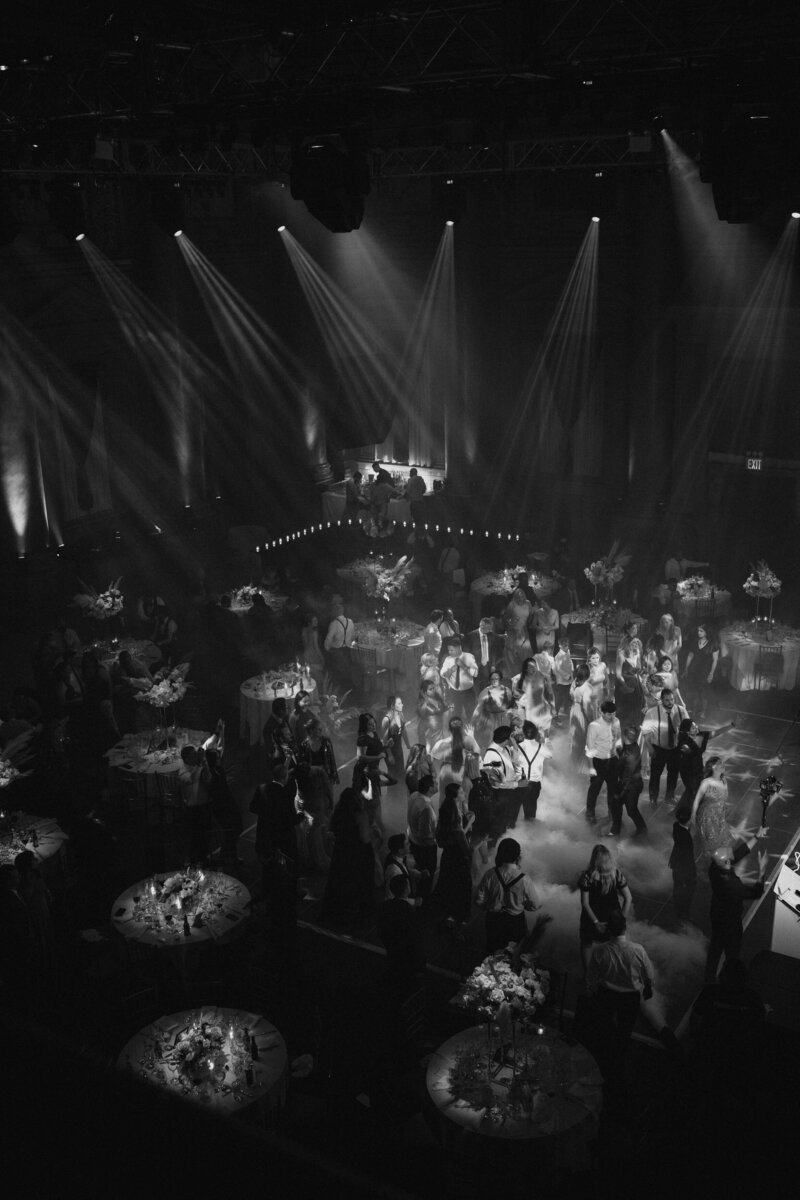 Overhead view of a wedding reception as people dance.