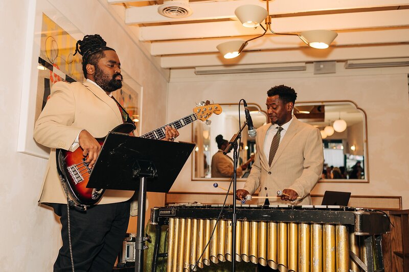 Live musicians playing at Dart Collective Chicago launch party at Lou Lou by Lola Cafe