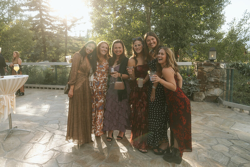 wedding guests posing at cocktail hour in Telluride