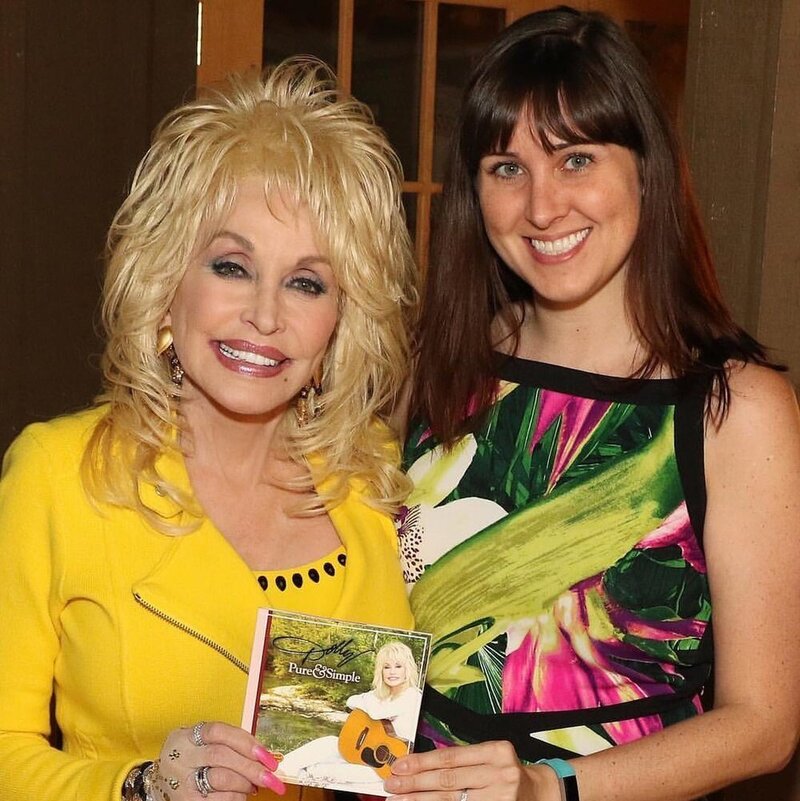 Brittany Hodak and Superstar Dolly Parton posing together with Dolly's CD