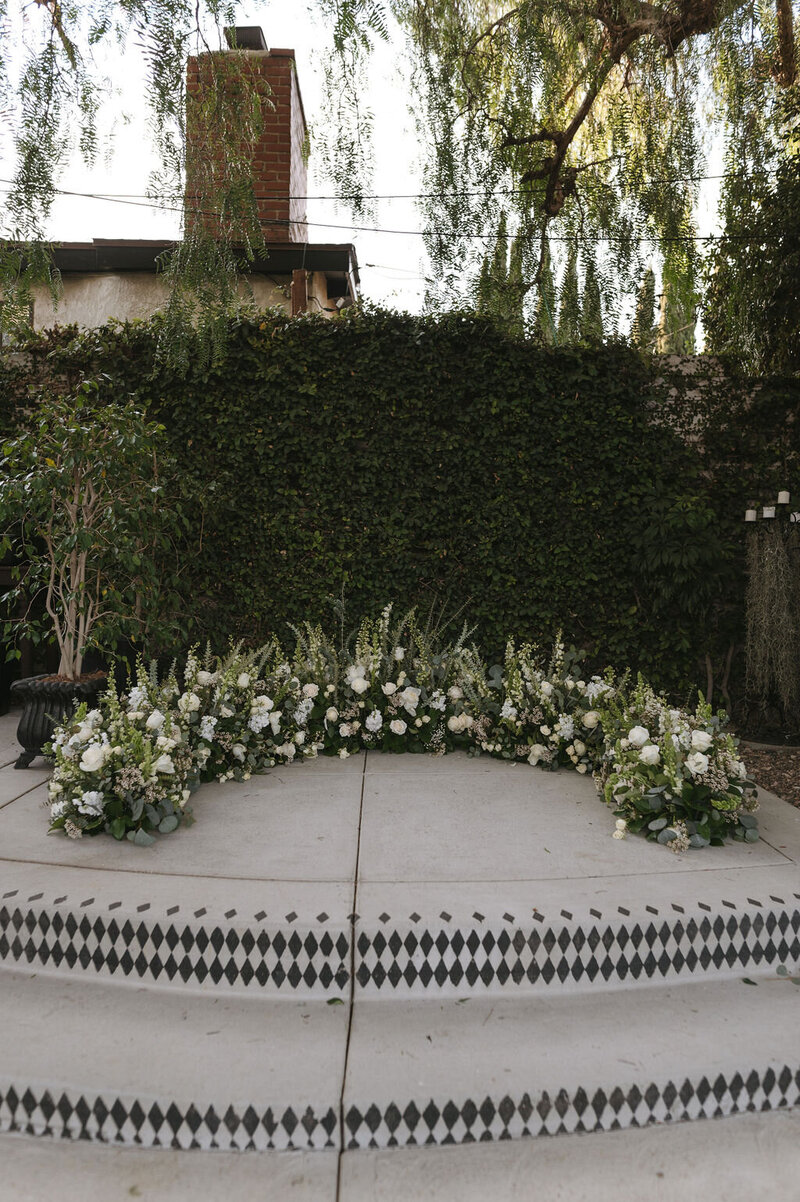 Floral altar installation at Sepulveda Home for Jenna and Joe’s Southern California wedding, planned by Beyond the Event and photographed by Maelani Janel Photo