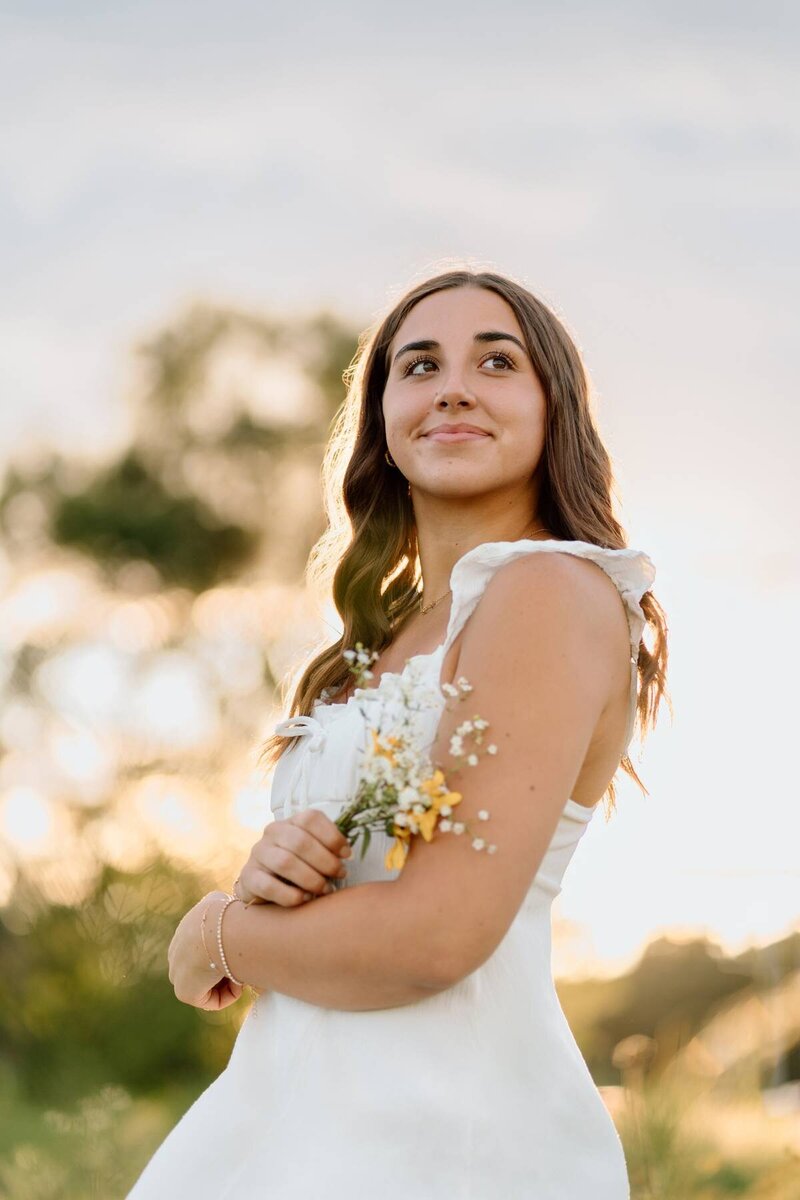 College senior portrait taken on campus, celebrating academic achievements and future goals