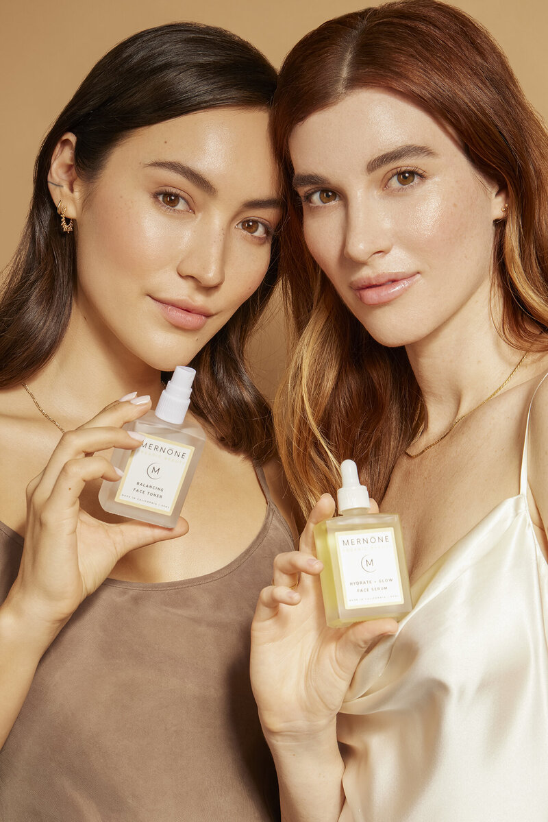 2 women showing skin care products los angeles