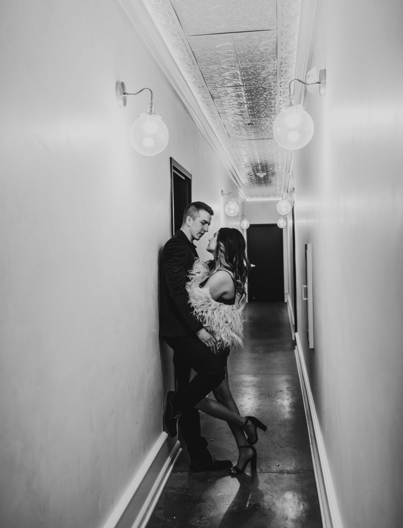 A couple standing in the hallway of the studio