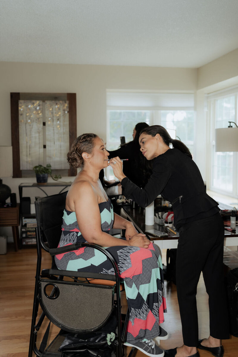 Behind the scenes makeup artist. Makeup Assistant Touchups on Mother of the Groom in Littleton, Colorado