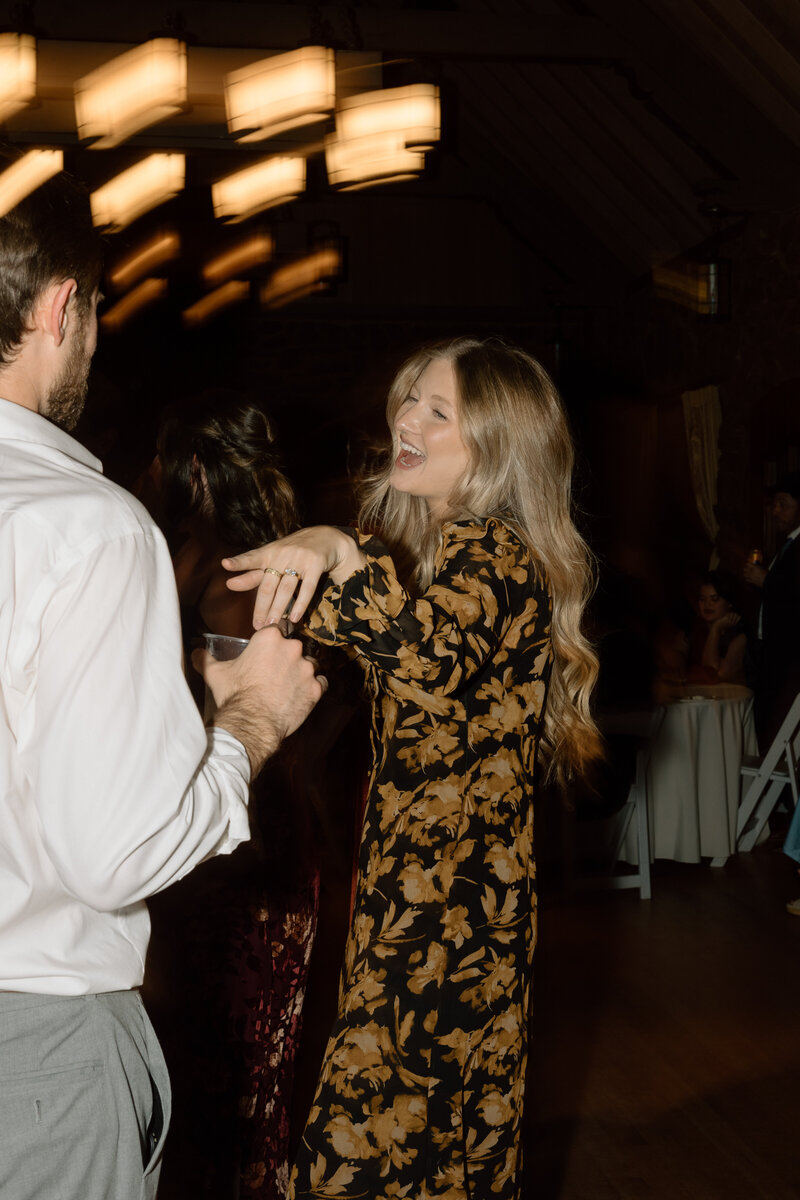 Candid dance floor moments at a lively Colorado wedding reception