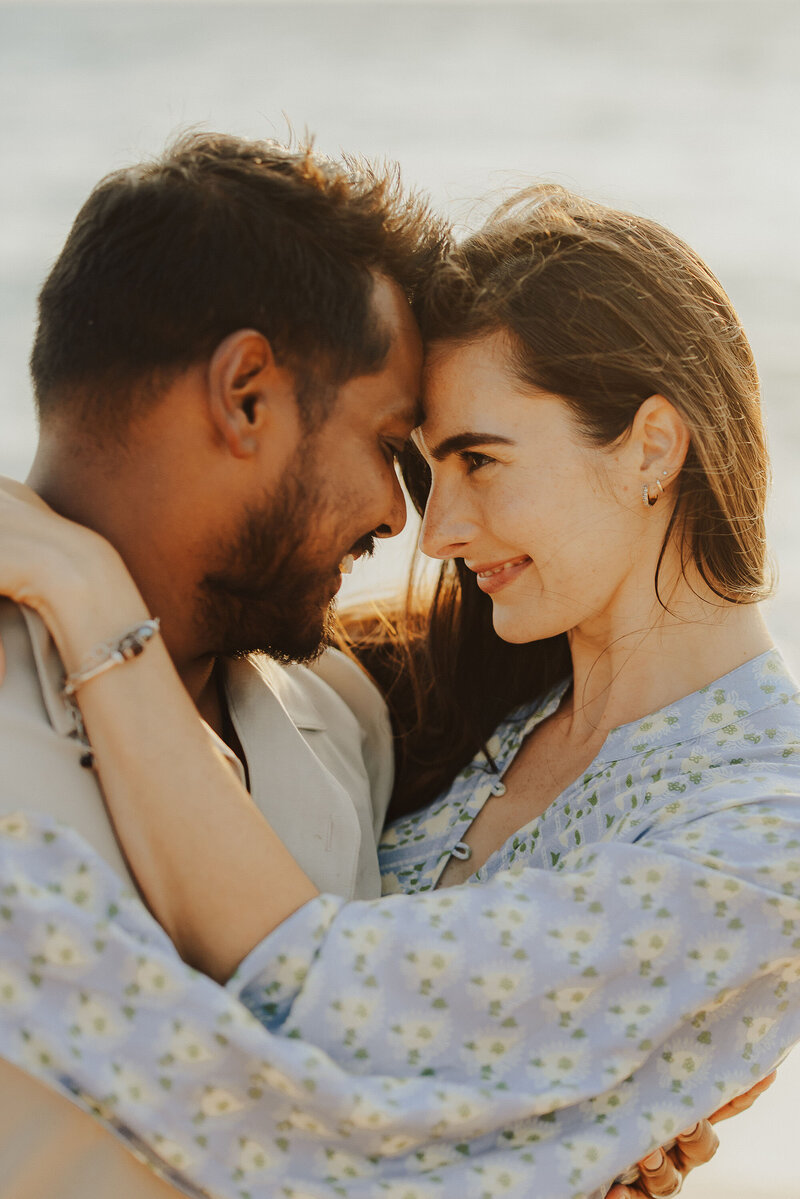 Couple hugs during golden hour