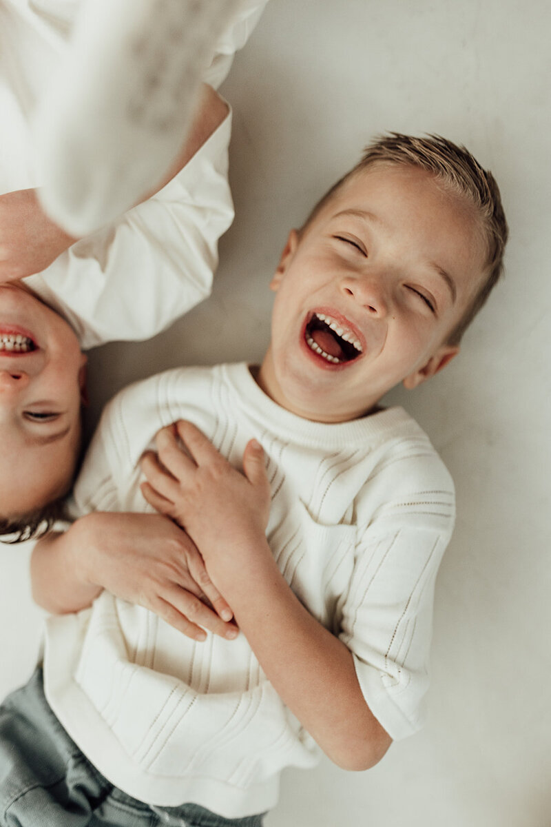 Overhead photo of two boys laughing 