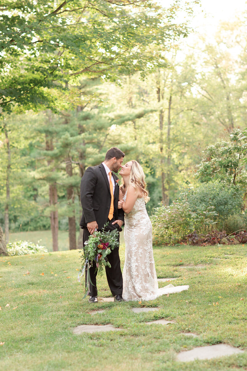 Bride and groom touching noses