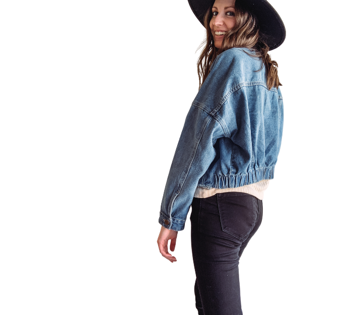 The Merry Hay in a blue denim jacket and black fashion hat