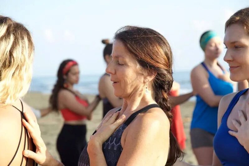 Student connecting to heart and mind during therapeutic yoga teacher training California