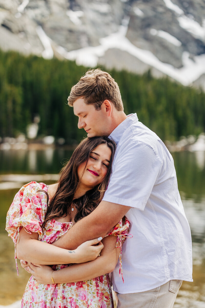Colorado Elopement Photographer captures woman hugging man during engagement photos