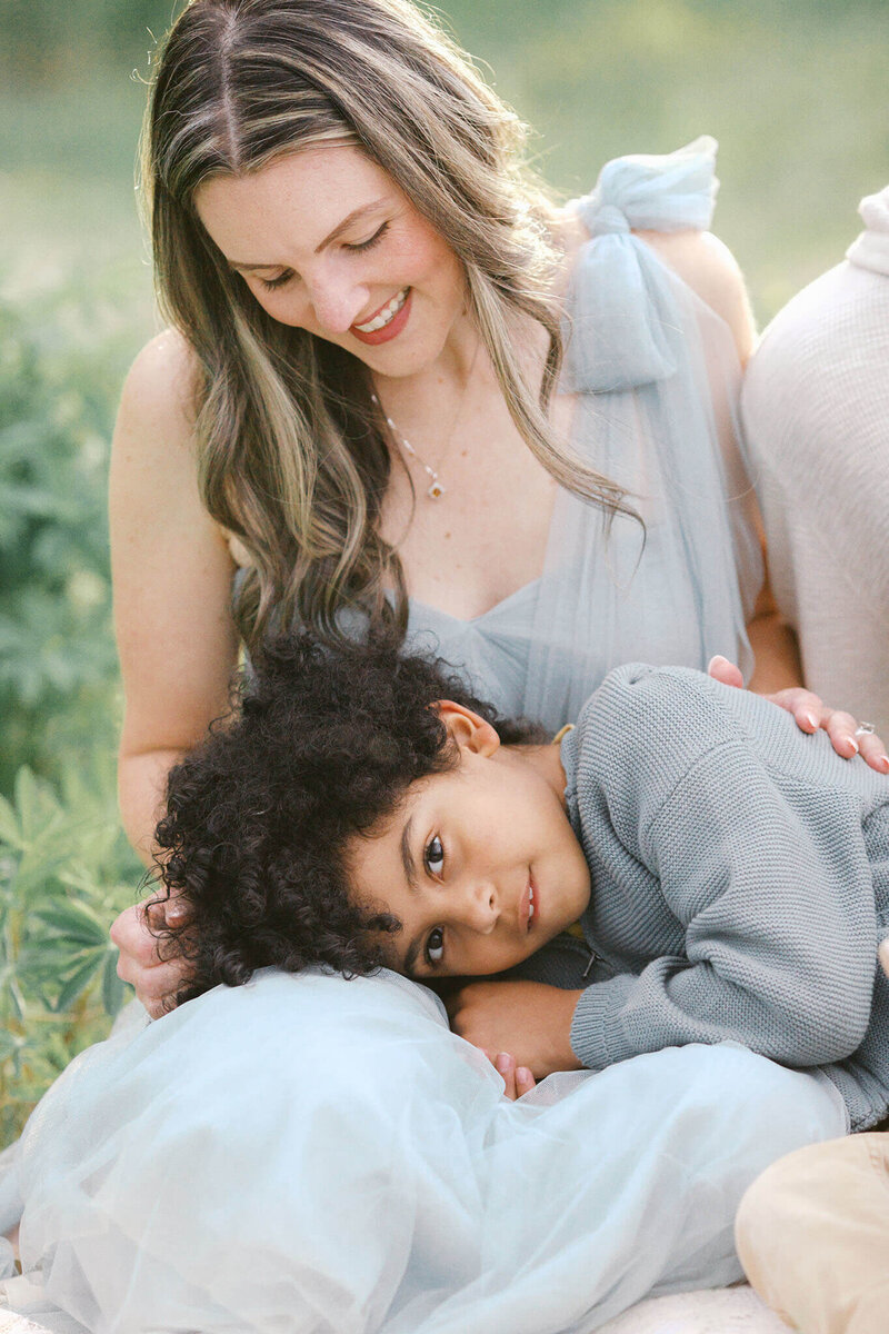 child with his head on his mother's lap from portland family photographer Samantha Shannon