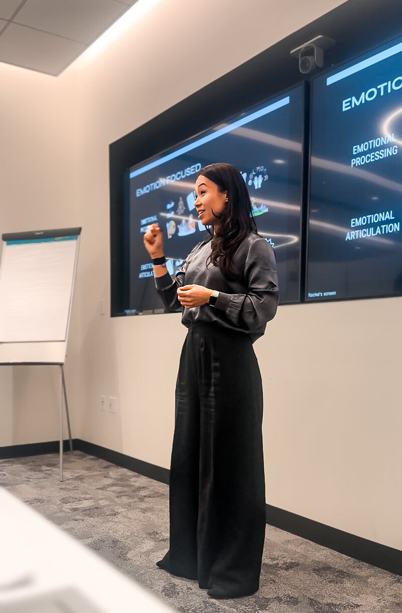 Rachel Lee guiding corporate professionals through breathwork techniques to reduce stress and enhance focus.