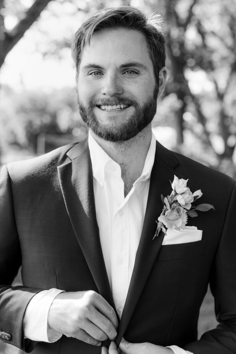 black and white groom portrait