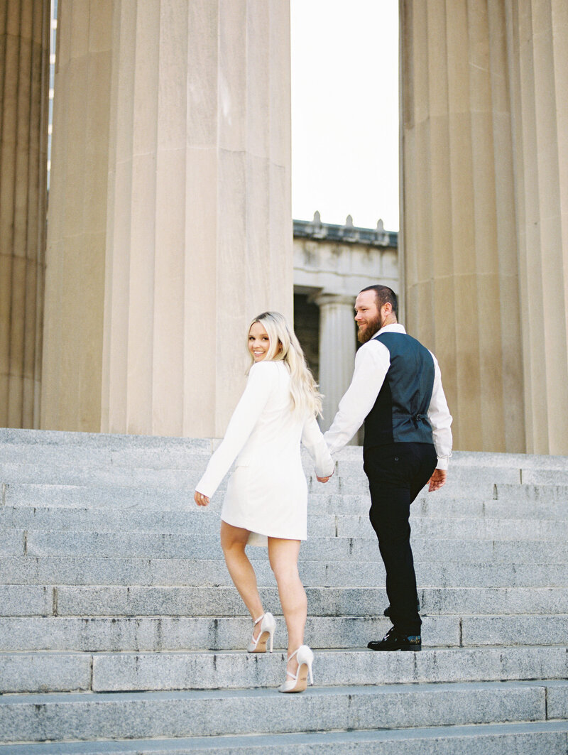 couples walks on sidewalk