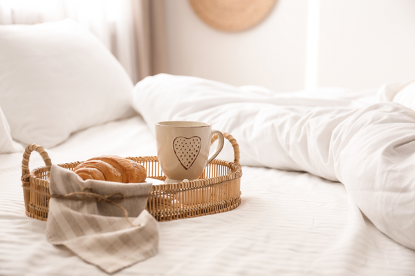 cozy bed with a breakfast tray