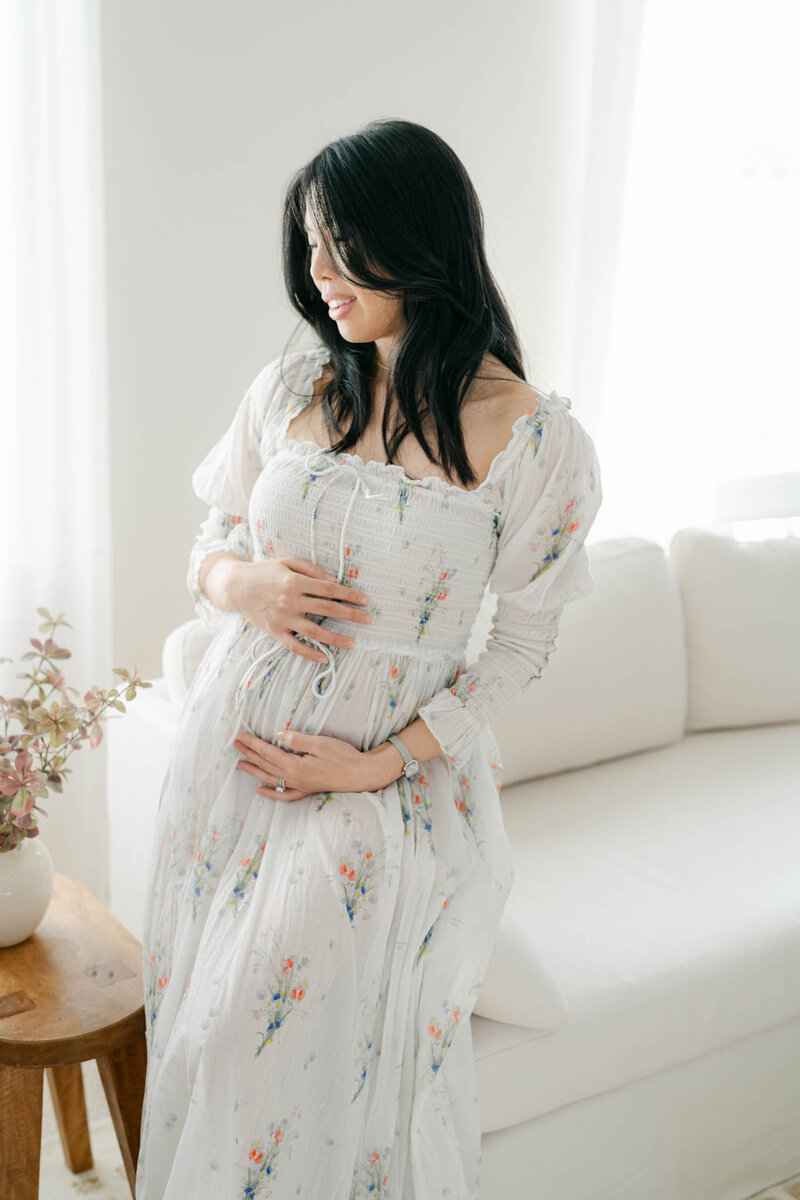 family poses with newborn baby and toddler