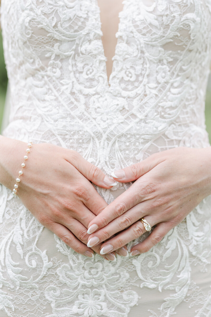 bride poses for wedding photos at an elegant angle