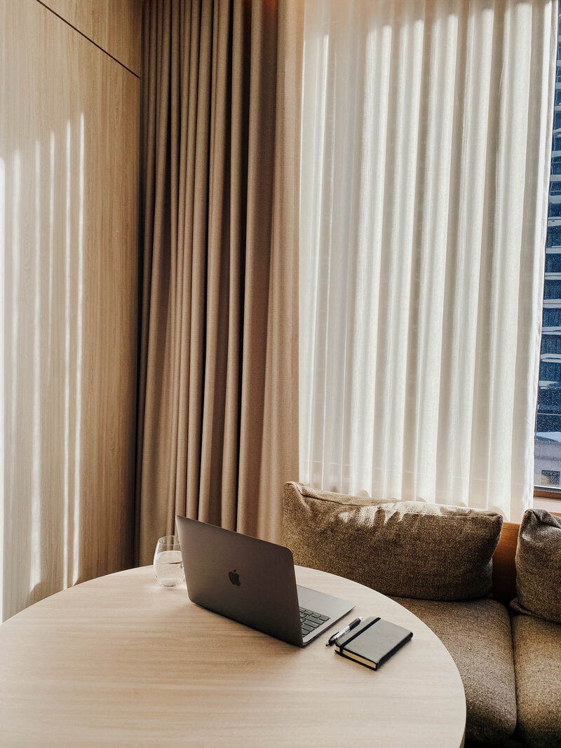 Comfortable office with a modern, neutral aesthetic for personalized client meetings. Tailored Oasis Travel Co.