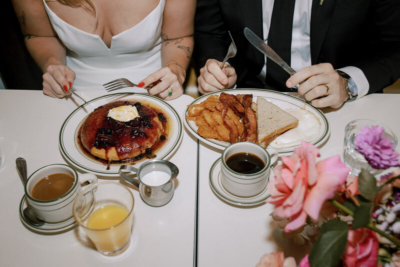 NYC city hall elopement breakfast at golden diner with bacon and blueberry pancakes