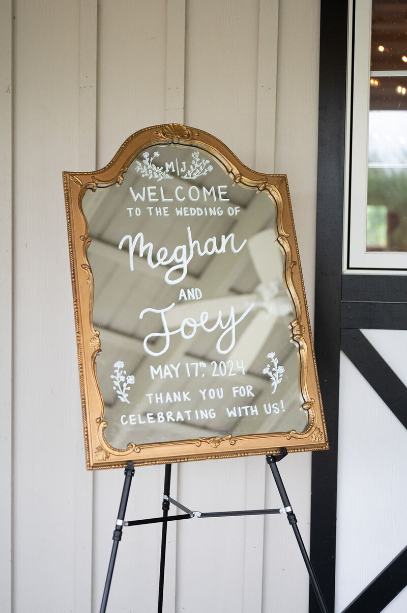 Gold framed wedding welcome sign for Meghan and Joey