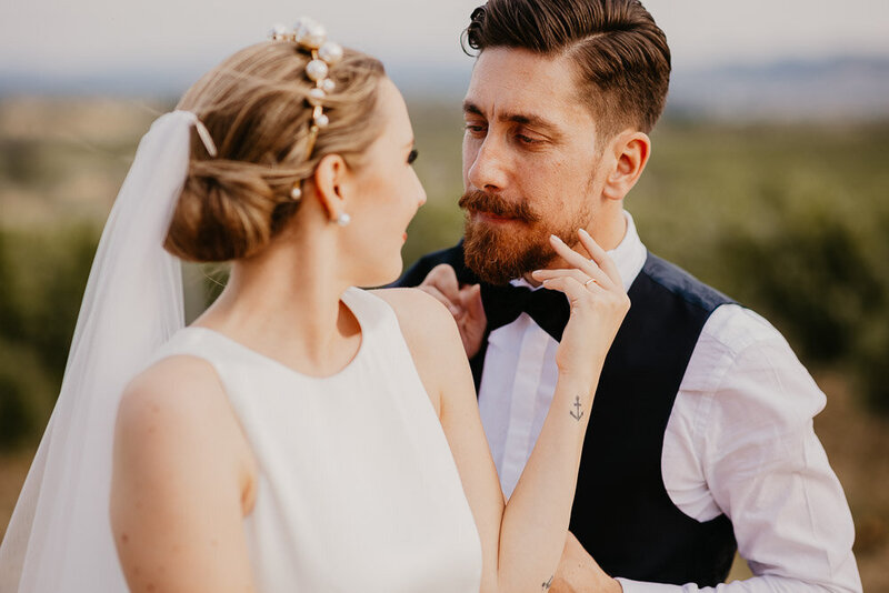 Couple portrait, the bride caresses the groom, Villa Dianella