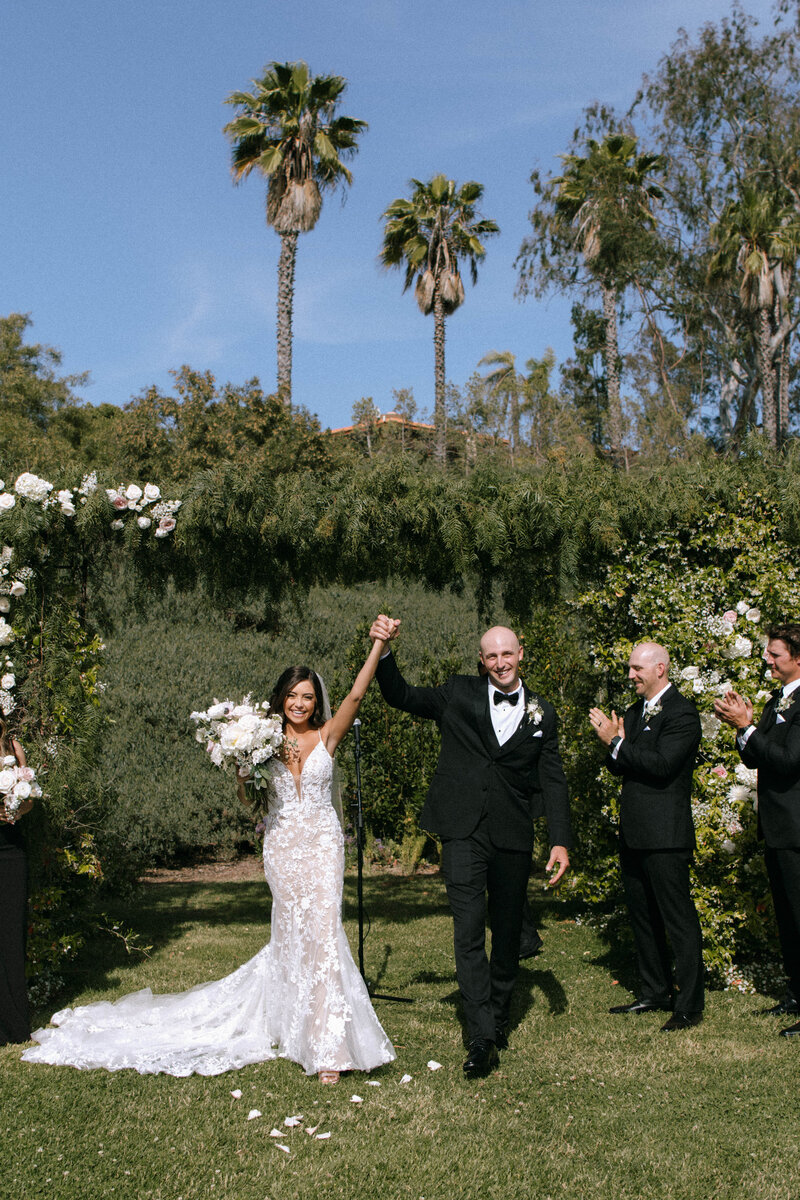 Bride and groom celebrating just married moment during an outdoor wedding ceremony in Seattle, captured by Seattle wedding photographer Rachael Marie Photography