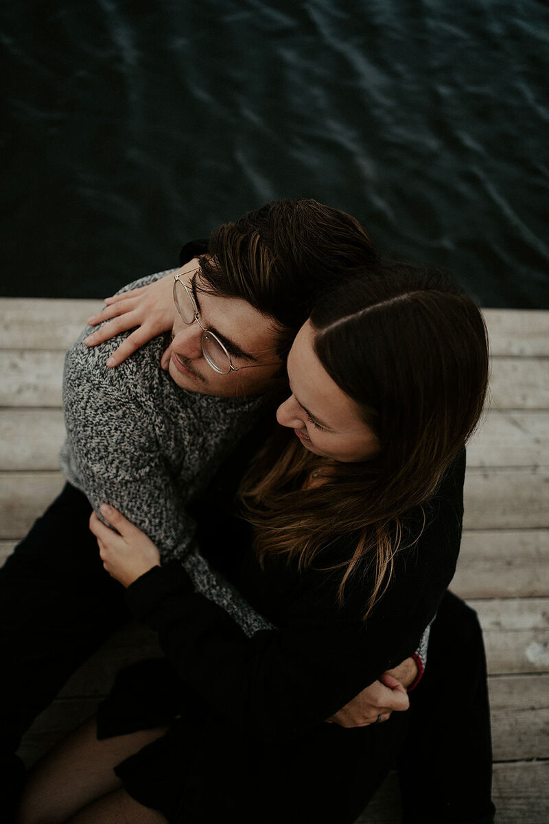 couple embracing touching heads