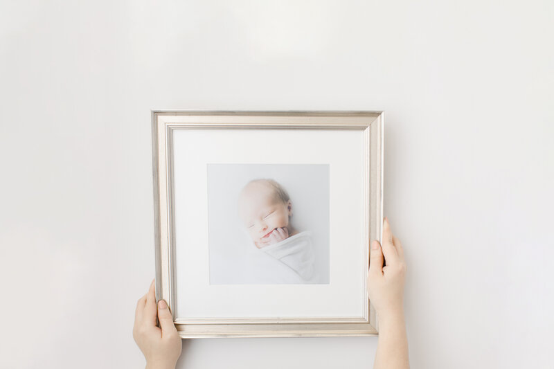 Custom framed portrait of newborn baby.