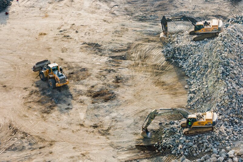 three-yellow-excavators-near-front-end-loader-1238864