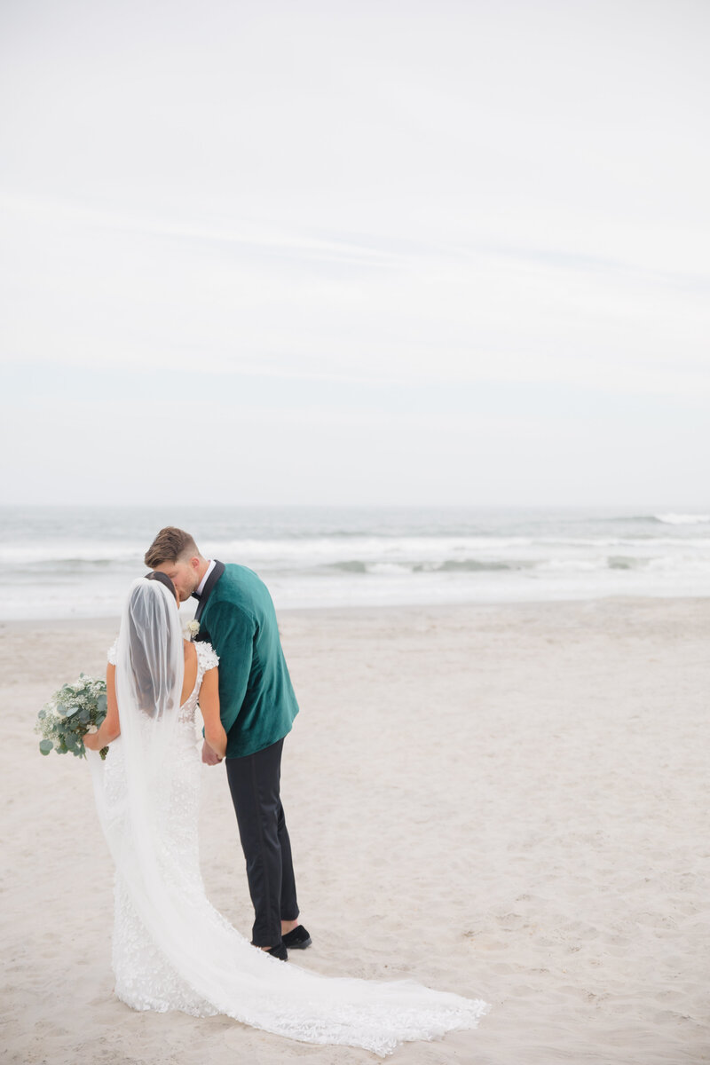 married couple kissing on the beach in cape may