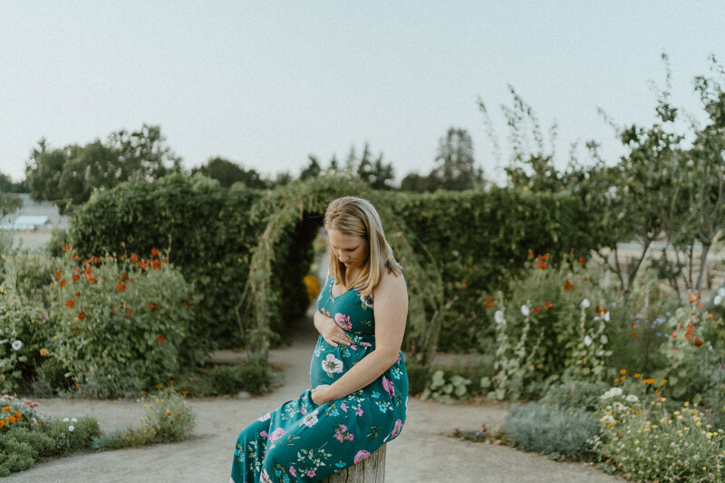 pregnant woman sitting in garden