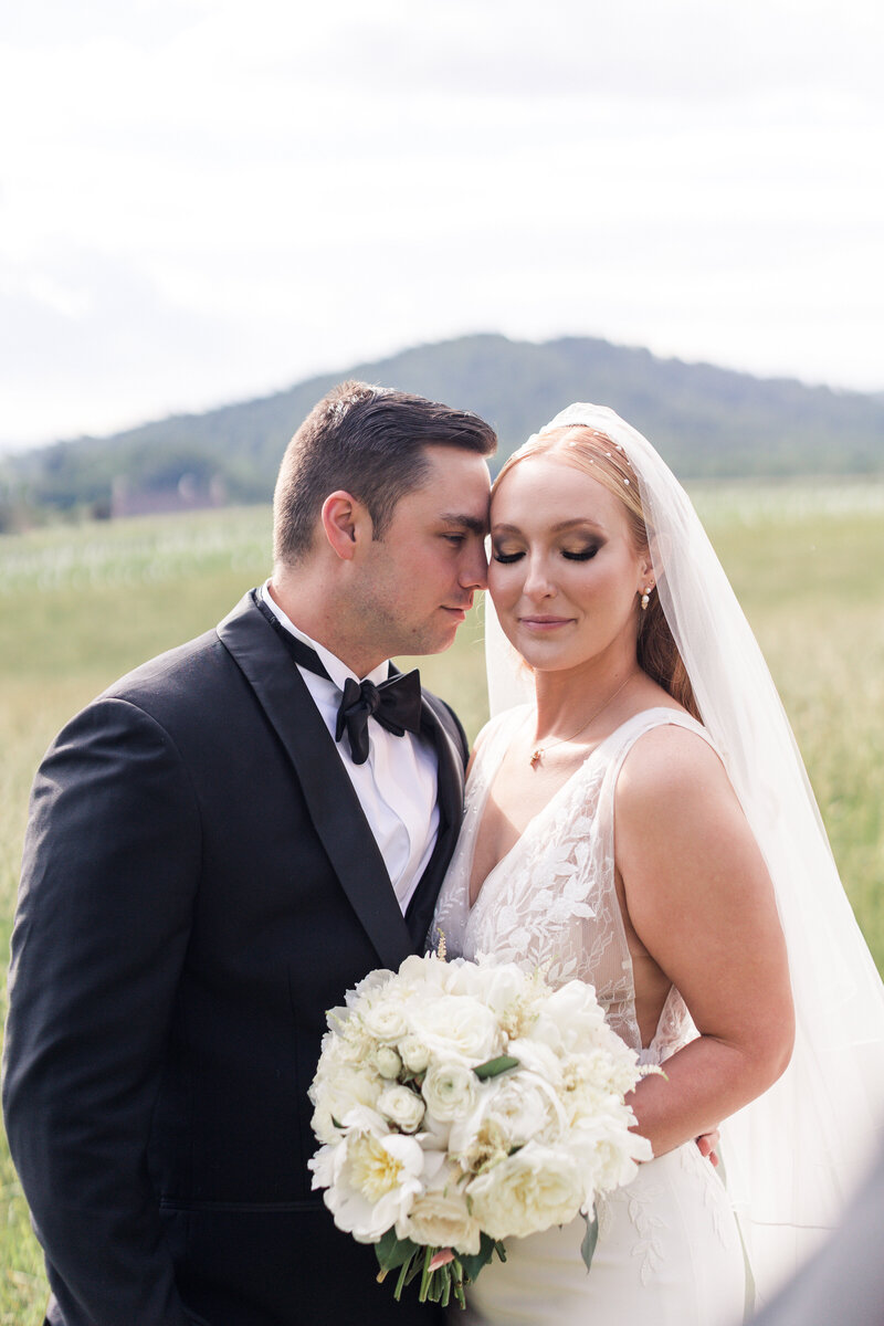 Bride and groom portrait framed by Charleston’s oak trees at Legare Waring House wedding.