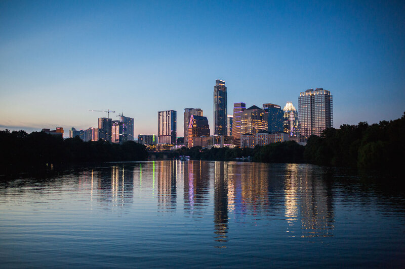 Austin skyline reflected in water at dusk