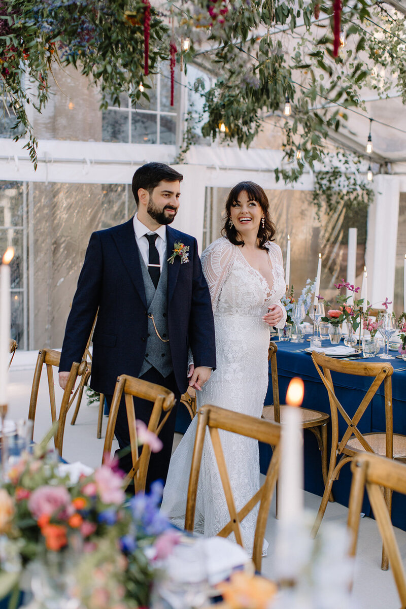 English groom and Ugandan bride at their at home marquee wedding.