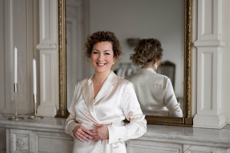 Confident woman in white jacket