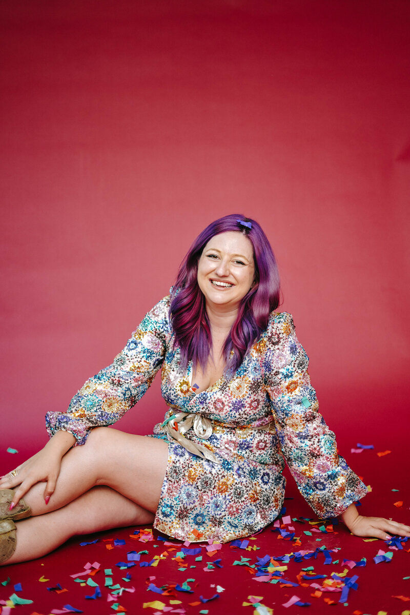 Photography Coach | Karinda K | Karinda sitting with confetti around her
