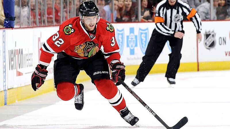 Former professional athlete Kris Versteeg playing ice hockey