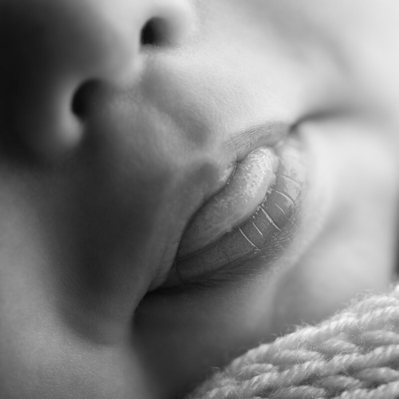 A timeless macro of newborn lips—real, raw, and tenderly captured in every delicate detail.