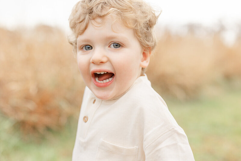 Toddler boy with a big smile for pictures in Prince William County, Virginia