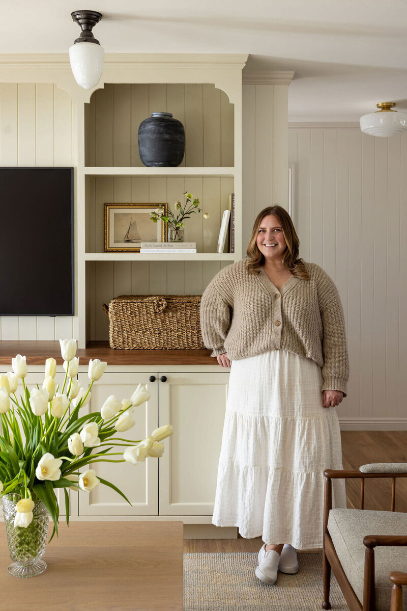 Photo of our lead interior designer and founder Ali Faulkner in one of her designed spaces in Orange County California