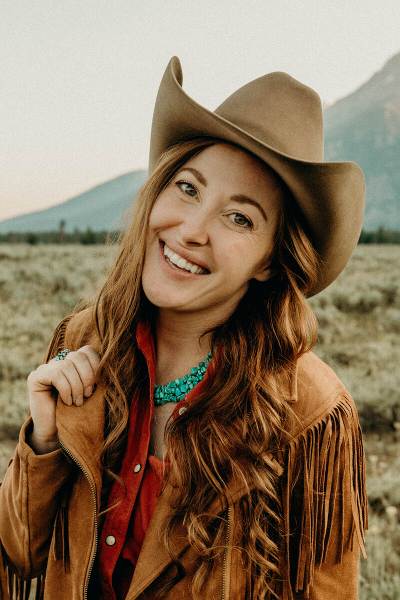 Jackson Hole Photographers poses in the Tetons for professional headshots for grand teton wedding