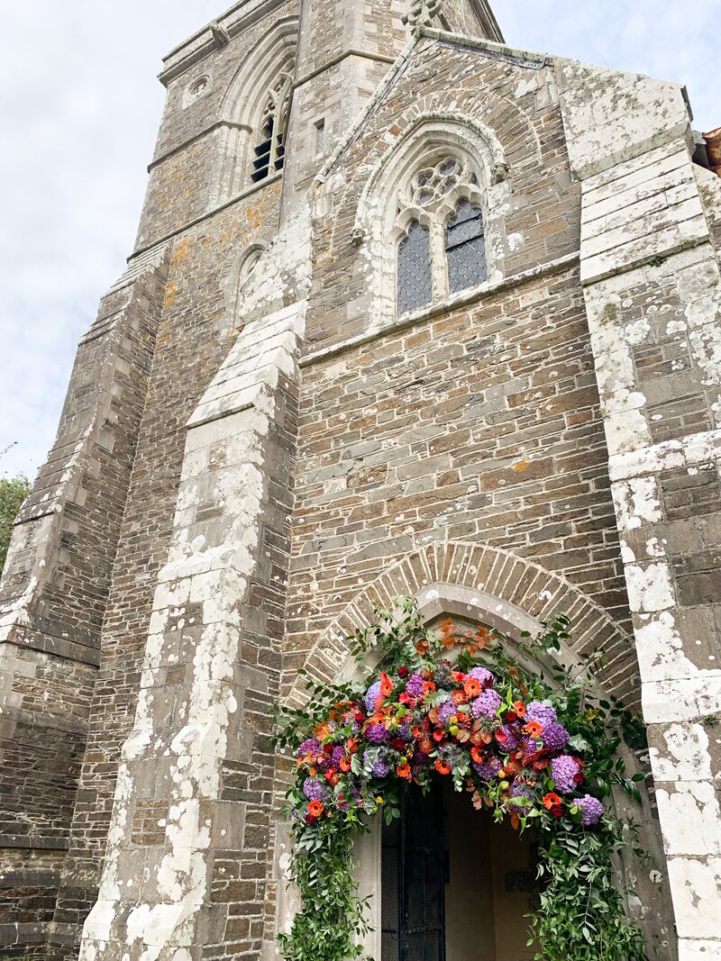 Church arch of flowers in bright colours
