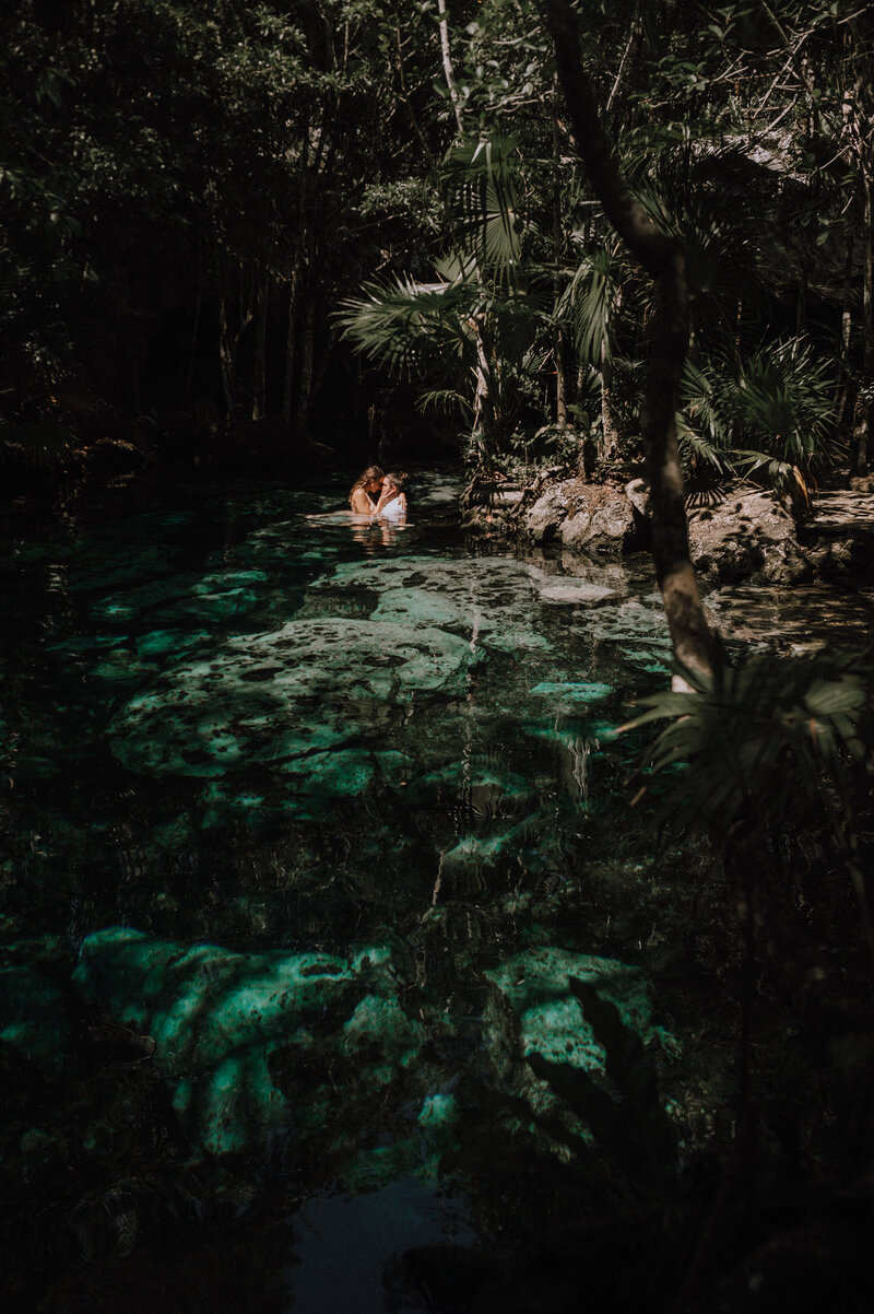 Trash the dress intimate photo session at a cenote in Tulum, Mexico.