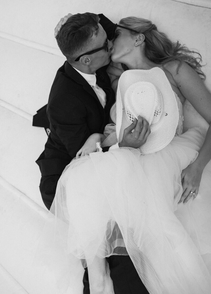 bride trying on dress and laughing