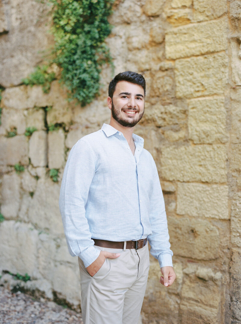 Portrait of David in St-Emilion during his engagement photo session, fine art style, smiling man
