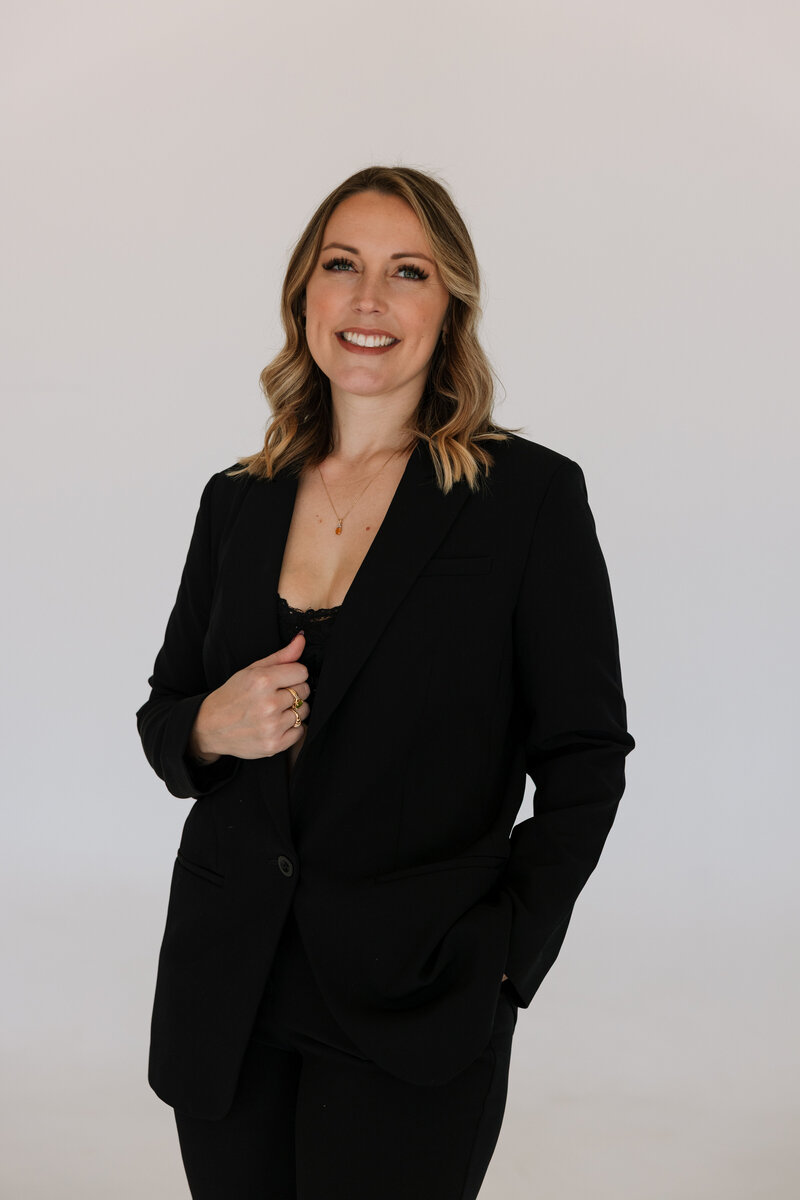 Wedding Photographers in Knoxville portrait with woman standing in a black suit for a headshot