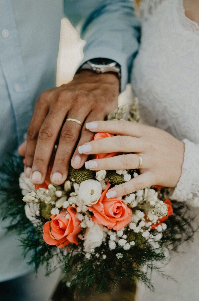 man-and-woman-s-hands-on-top-of-ball-bouquet-1730877