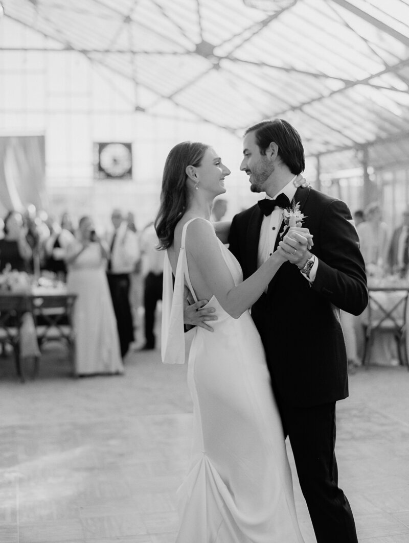 black and white wedding image of couple embracing